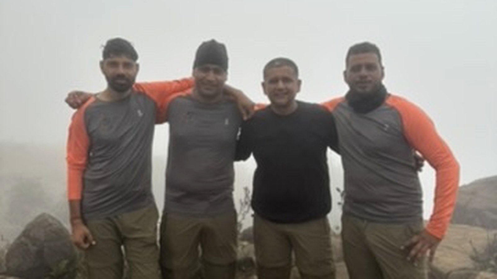 Former Indian Commandos leading a group across an exposed ridge